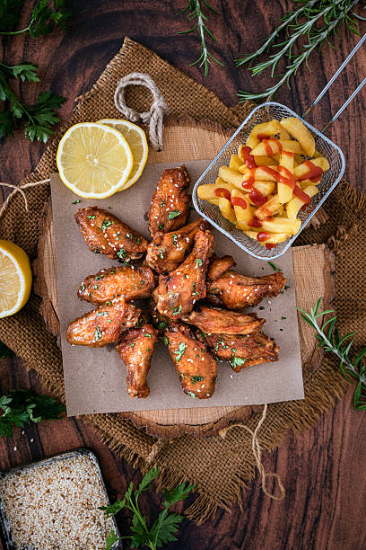 Honey chicken wings on a rustic background