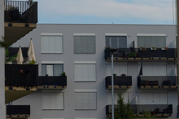 istock Modern Apartment Building with Balconies and Clear Sky 2234102503