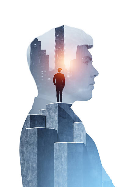 istock Double exposure image of confident businessman standing on stone 2234104791