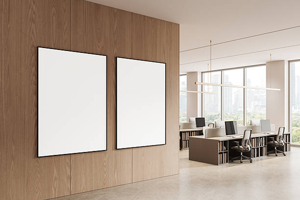 istock Two blank poster mockups on wooden wall in modern office interior with clean layout and natural light overlooking cityscape through large windows. 3D Rendering 2234104864