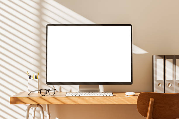 istock Modern workspace desktop computer screen mockup with keyboard, glasses, and accessories on wooden desk in cozy sunlight interior design concept. 3D Rendering 2234104961