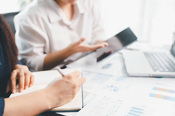 istock Business meeting, data analytics or women with graph presentation in office. Chart, analysis accounting team brainstorming economy, inflation or solution. business project finance investment concept. 2234105702