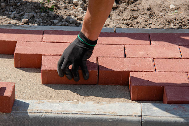 istock Crafting a brick pathway with precision and care in a residential garden during daylight hours 2234106230