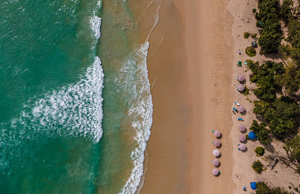istock Top view beach with waves crashing on sandy shore 2234110789