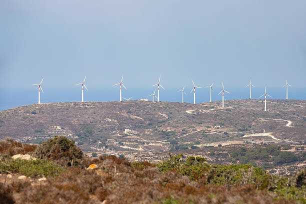 Wind Turbines on a Hillside Under a Blue Sky, Kos, Greece