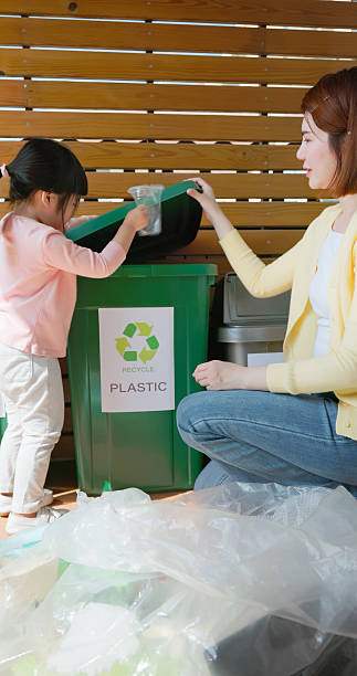 istock Asian Mother Teaching Recycling 2234122328