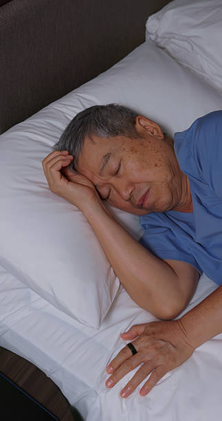 istock asian elderly wear smart ring sleeping home 2234129185