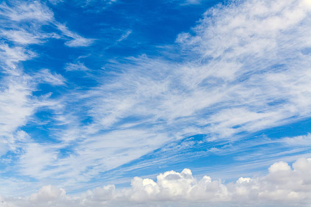istock A vibrant blue sky filled with wispy cirrus clouds and fluffy cumulus formations, creating a serene and expansive natural backdrop 2234129394