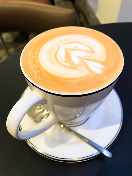 istock A white coffee cup on a table black coffee, cappuccino 2234129963