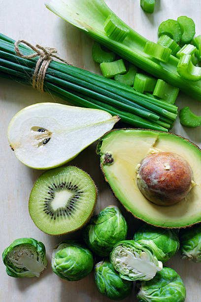 Fresh, healthy fruits and vegetables displayed on a neutral surface for dieting plan