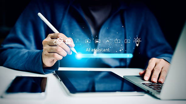 istock A person uses a digital pen with a tablet and laptop, supported by AI assistant technology for smart work, automation, and innovation, representing future artificial intelligence in business and creativity. 2234139922