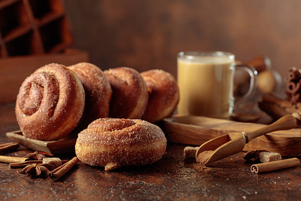 istock Swedish cinnamon rolls and coffee latte on a brown background. 2234140729