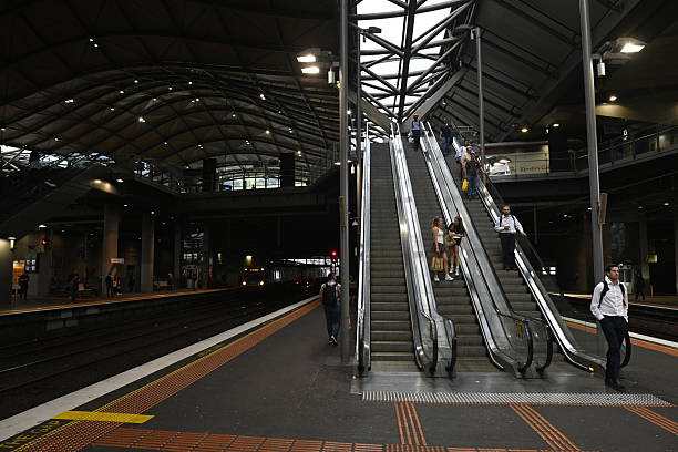 Melbourne, Australia - February 26, 2025: People use the escalators at Southern Cross station in Melbourne.