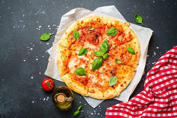 istock Pizza margarita on black background with ingredients for cooking. 2234145084