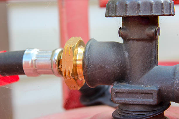 istock Stainless steel pipe connected to red cylinder 2234146392