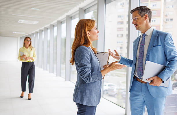istock Business colleagues having a lively discussion in modern office 2234150675