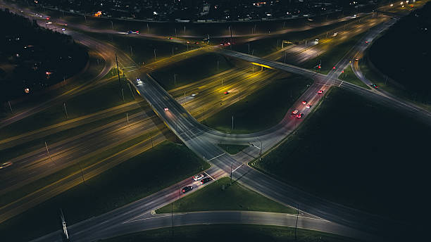 istock Aerial Night View of Illuminated Highway Interchange 2234150975