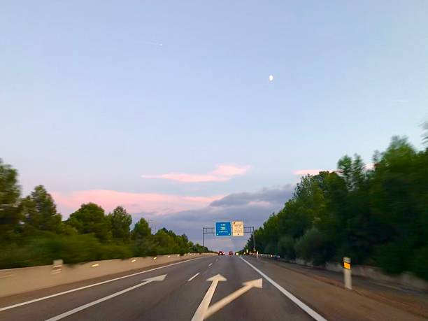 istock Empty Highway at Dusk with Pink Sky and Trees 2234155927