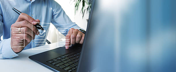 istock The businessman works at a desk with a computer and documents. 2234158059