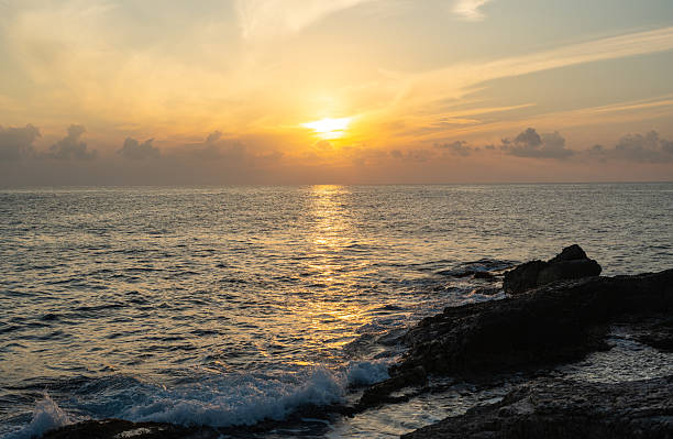 istock Sunset over the Mediterranean Sea with soft waves and glowing clouds. 2234159395