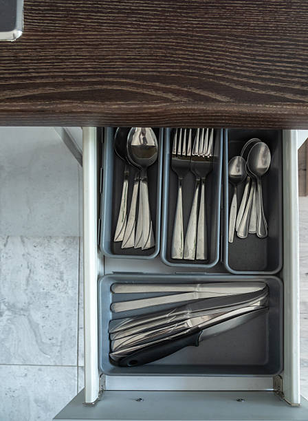 istock Top view of open kitchen drawer with metal cutlery arranged inside 2234161628