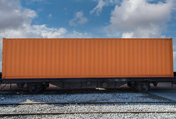 istock Train wagon carrying cargo containers for shipping companies. 2234162049