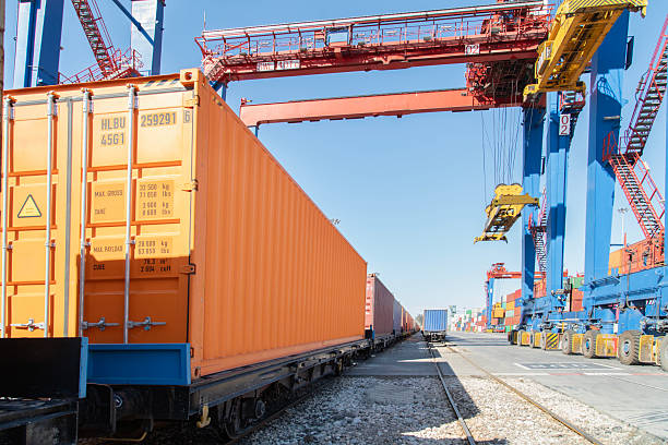 istock Train wagons carrying cargo containers for shipping companies. 2234163801