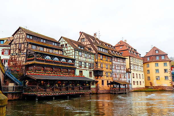 Colmar riverbanks come alive at Christmas with beautifully decorated historic buildings, warm lights, and the festive spirit along the waterway in the city.