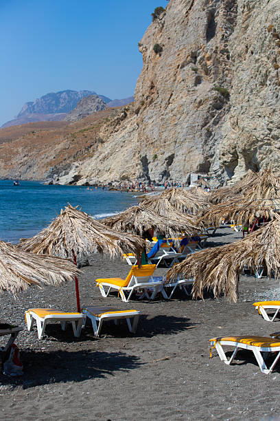 istock Embros Therma, a beach with a hot thermal spring, cliffs and umbrellas on a sunny day 2234174958