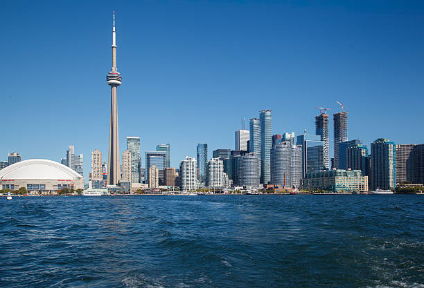 September 27, 2020 - Toronto, Ontario, Canada: Toronto skyline and Lake Ontario with sail boats taken from Tommy Thompson Park. Weekend walking in Tommy Thompson Park in Toronto. Toronto active weekend. Travelling in Ontario. Sightseeing Toronto. North American big city. Toronto city life.