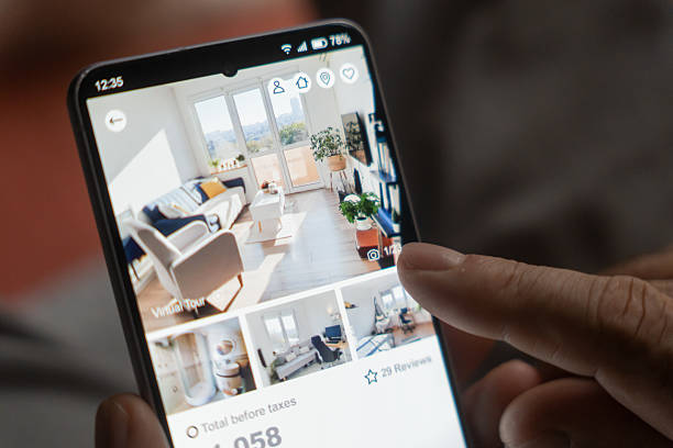 istock Man uses smartphone to search for new home 2234202376