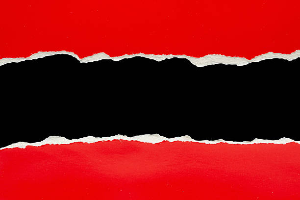 istock Red ripped paper torn edges strips isolated on black background 2234209285