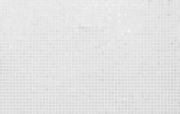 istock White tile wall background texture. Ceramic brick wall and floor tiles mosaic background in bathroom. 2234209394