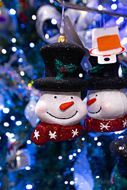 istock Snowman face Christmas decoration with holiday sparkle 2234210573