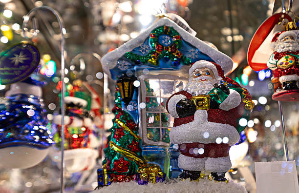 istock Santa Claus figurine with holiday tree and present 2234210601