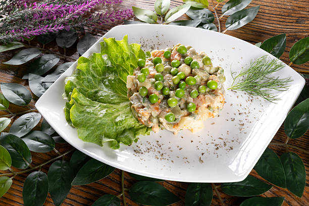 A photo showcasing Olivier, a traditional Ukrainian salad with potatoes, peas, and mayo, presented with vibrant colors and a hearty appeal.