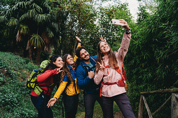 istock Four friends are taking a selfie together while they are hiking 2234217510