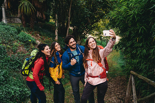 istock Four friends are taking a selfie together while they are hiking 2234217522