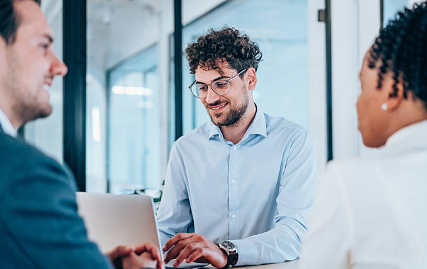 istock Group of business persons talking in the office. 2234217649