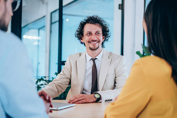 istock Group of business persons talking in the office. 2234217650