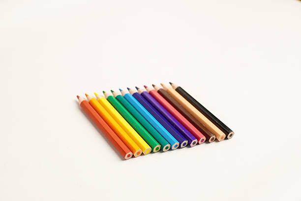 istock Back view of colored pencils arranged on white background 2234222611