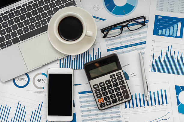 istock Business graphs, charts, laptop, magnifying glass and calculator on table. Financial development, Banking Account, Statistics. 2234224422