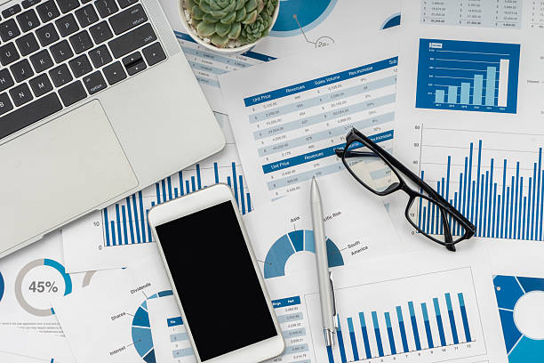 istock Business graphs, charts, laptop, magnifying glass and calculator on table. Financial development, Banking Account, Statistics. 2234224444