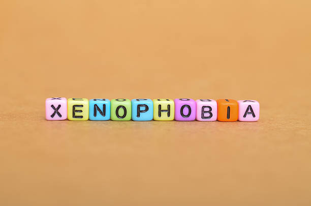 istock toy blocks spell out Xenophobia to raise awareness about intolerance. A direct visual message about prejudice, fear of foreigners, and discrimination 2234224574