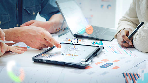 istock Close up Diverse Collaborative Business people meeting on devices computer with digital generate animated brainstorming the financial report paperwork document analyzing data or planning strategies displays a graph or chart in a modern business technology 2234227900