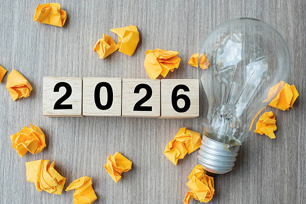 istock 2026 text wood cube blocks and crumbled paper with lightbulb on wooden table background. New Year New Ideas, Creative, Innovation, Imagination, inspiration, Resolution, Strategy and goal concept 2234230136