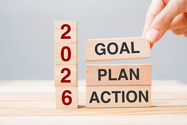 istock hand holding wooden block with text 2026 GOAL, PLAN and ACTION on table background. Resolution, strategy, solution, goal, business and New Year holiday concepts 2234230164