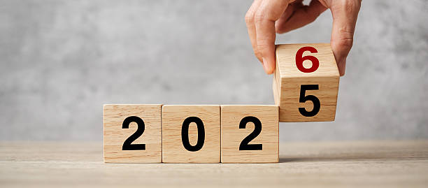 istock hand flipping block 2025 to 2026  text on table. Resolution, strategy, plan, goal, motivation, reboot, business and New Year holiday concepts 2234230189