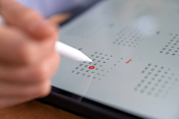 istock Digital tablet with stylus highlighting a calendar date 2234231536