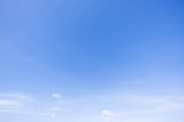 istock Panoramic view of clear blue sky and clouds, Blue sky background with tiny clouds. White fluffy clouds in the blue sky. Captivating stock photo featuring the mesmerizing beauty of the sky and clouds. 2234232139
